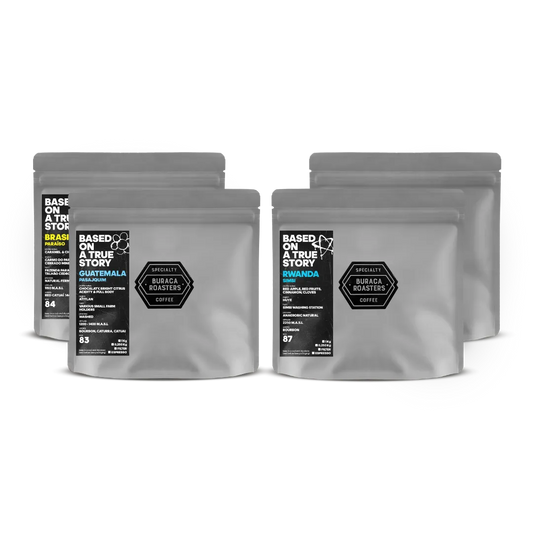 Four 250g coffee bags from Guatemala, Rwanda and Brazil, showcasing diverse flavor profiles: chocolate, bright citrus acidity and a full body; chocolate, roasted almonds, apple; red apple, red fruits, cinnamon and cloves; caramel and chocolate